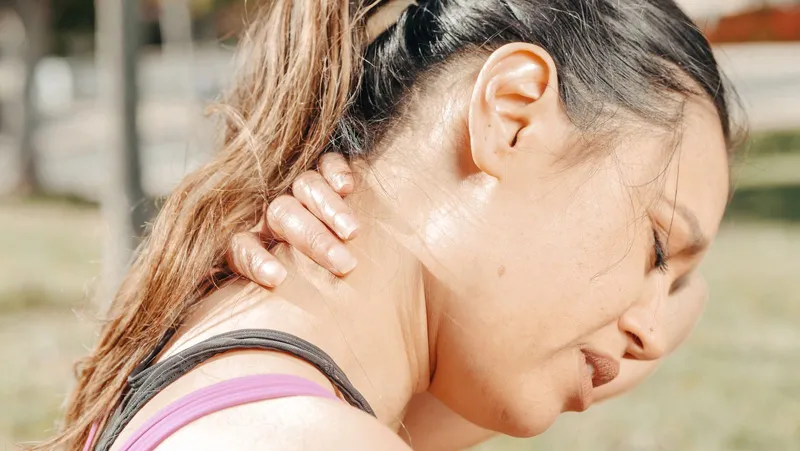 Athlete grimacing in discomfort during outdoor training