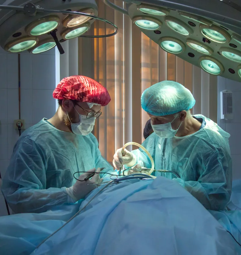 Surgical team performing a procedure in an operating room